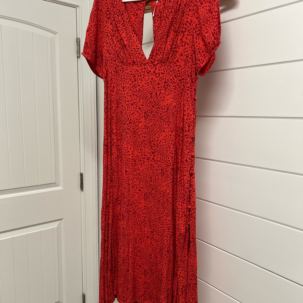 Free People above the ankle dress. Side buttons all the way down.